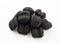 BBQ dark charcoal briquettes pile