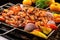 bbq grill plate full of sizzling shrimp skewers