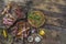 Bbq party fest Assortment various barbecue raw food meat, on plates wooden cutting board and grid on an old brown board