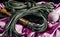 bdsm still life black leather whip rope shibari and christmas ball on pink cloth