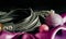 bdsm still life leather whip rope shibari and christmas ball on pink cloth close up