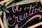 Be Creatvie - colorful chalk lettering motivational quote closeup.