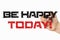 Be happy today. Phrase on a whiteboard, written with black and red marker in a hand. Scribble sketch text