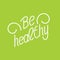Be healthy. Hand lettering phrases on green background.