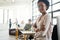 Be humble and stay hungry. Portrait of a young designer standing in an office with her colleagues in the background.