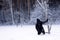 Be jaded. The lonely exhausted TRAVELER fell to his knees. Dramatic silhouette of a man on a snowy meadow in the forest