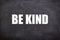 Be kind white text and quotes with blackboard background.