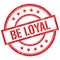 BE LOYAL text written on red vintage stamp