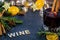 Be merry and red spiced wine winter holiday still life concept on dark slate board with dried oranges, anise stars, cinnamon