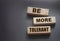 Be More Tolerant words on wooden blocks on dark background. Tolerance Equality diversity social concept