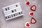 Be my Valentine light box with felt hearts decor on cement background