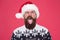 Be positive. brutal hipster favorite sweater red background. winter holiday fun. happy face mustache. portrait of santa