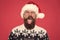 Be positive. brutal hipster favorite sweater red background. winter holiday fun. happy face mustache. portrait of santa