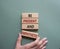 Be Present and Empathetic symbol. Concept words Be Present and Empathetic on wooden blocks. Businessman hand. Beautiful grey green