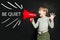 Be quiet concept. Funny little girl screaming loudly through a megaphone Be quiet