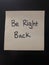 Be right back sticky note on a computer monitor