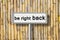 Be right back written on road sign