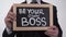 Be your own boss phrase on blackboard in businessman hands, startup company