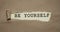 Be yourself phrase written under torn paper. Personal brand rebranding concept