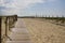 Beach access wooden pathway of atlantic sea in sand dunes with ocean in gironde France southwest