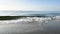 Beach aerial surf waves on a sunny day