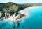 Beach aerial view. Nice top view of the blue ocean, crashing wave and white sand.