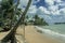 The beach of Axim city overlooking the sea and the castle.