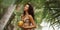 Beach Babe, Tanned Bikini-Clad Woman Enjoying Fresh Coconut Water on Sandy Shore