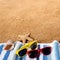 Beach background border sunglasses, towel, starfish, seashell square sand copy space