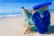 Beach bag with flip flops by the ocean