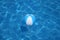 Beach ball in blue water