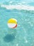 Beach ball floating in the ocean.