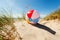 Beach ball in sand dune