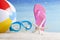 Beach ball and snorkel mask on the beach