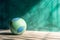 Beach ball on the stone floor near grunge stucco turquoise wall, vivid sport background. Created with generative Ai