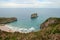 Beach of Ballota Llanes, Asturias with the shape of a shell and a coastal islet Castro Ballota