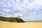 Beach and Ballybunion castle on the edge of a cliff