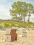 Beach of the Baltic Sea near Ahrenshoop with beach chairs and thatched house