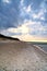 On the beach of the Baltic Sea. Sunset, groynes, beach and sand. Landscape shot