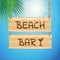 Beach bar hanging wooden board with sunny sky background and palm leaf