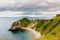 Beach on a bay cover with cliffs by English coast