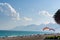 Beach on the beach with paragliders on the background of mountains