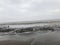 Beach With Beautiful Sky Clouds In India. Black Soil over the beach