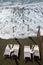 Beach beds and beach umbrellas empty by the sea