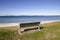 A Beach bench seat on green grass with sea view at Brighton le sands, Sydney, Australia.