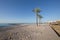 Beach in Benicassim with wooden walkway and palm trees