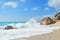 Beach with big rocks and wild sea