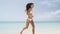 Beach bikini woman carefree running in freedom fun
