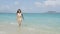 Beach bikini woman walking out of sea swimming