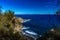 Beach with black volcanic sand, green palm trees on the slope, dangerous waves, Atlantic Ocean, Castro Beach